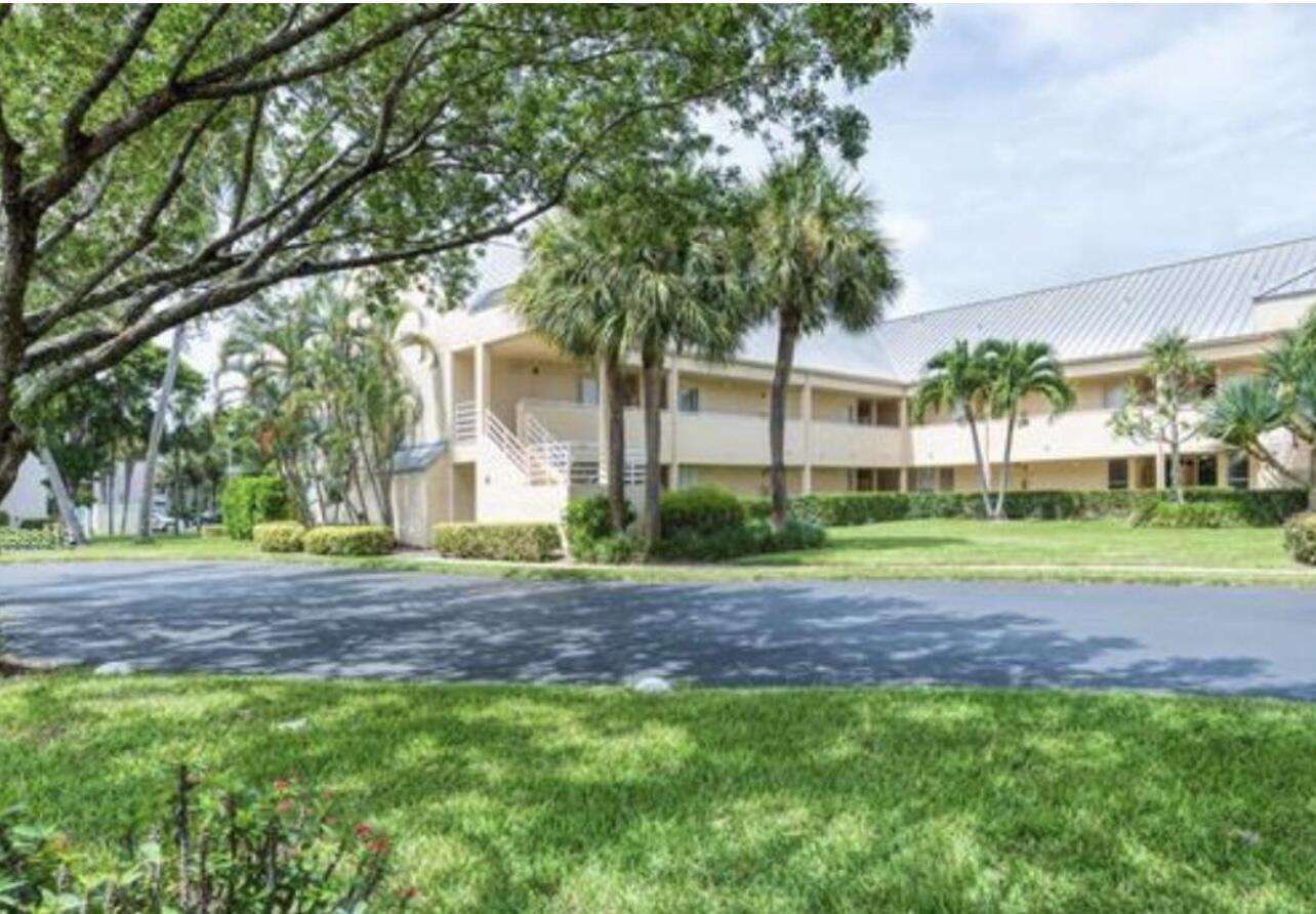 1605 Highway 1, Unit M2202 Jupiter, FL 33477 - Photo 16 of 19 a view of a house with a yard