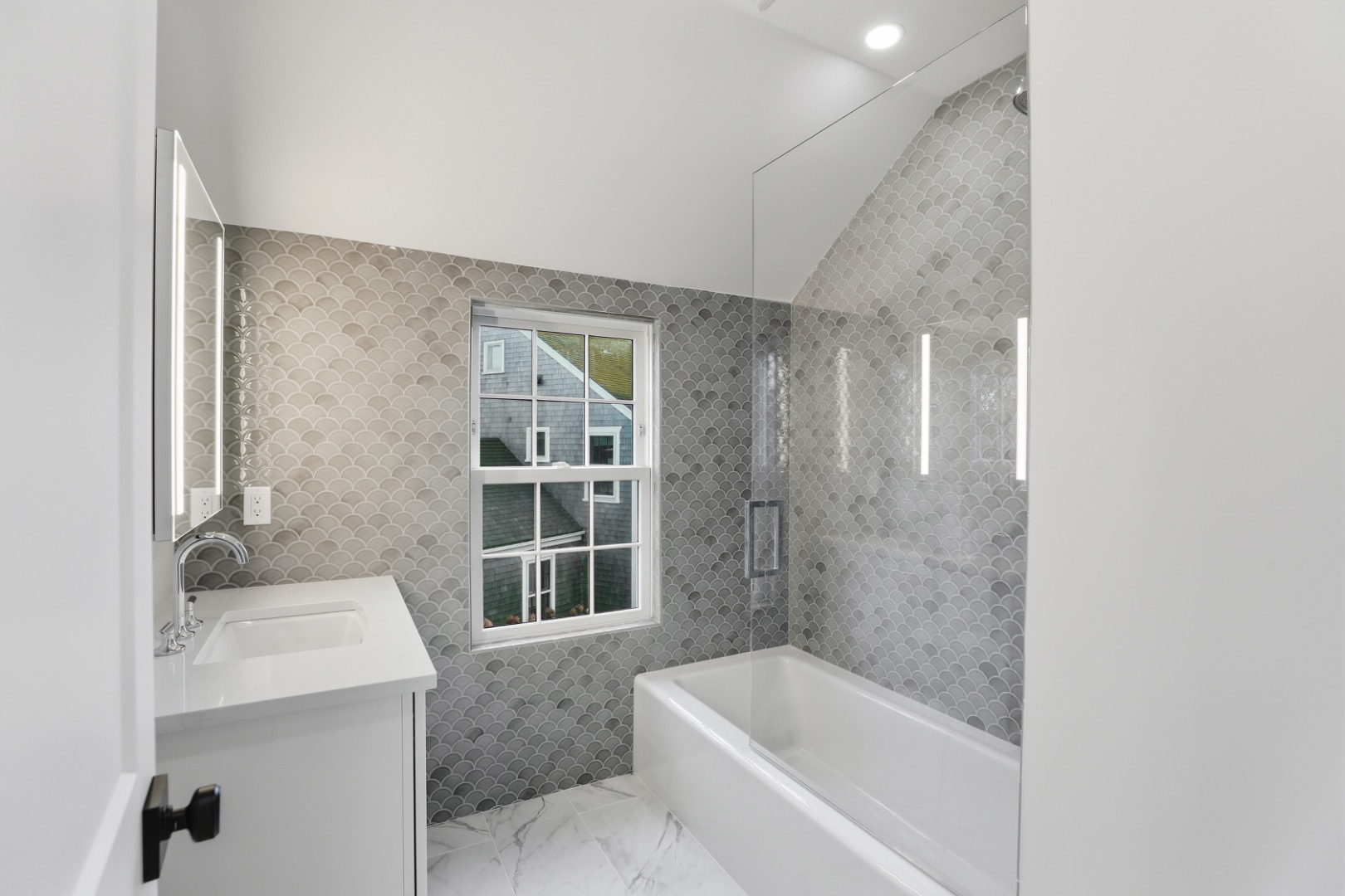 6 Mariner Way Nantucket, MA 02554 - Photo 27 of 31 a bathroom with a granite countertop sink a toilet and bathtub