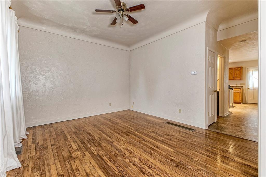 147 South Quarry Street Mount Pleasant, PA 15666 - Photo 11 of 30 a view of a room with wooden floor and a bathroom