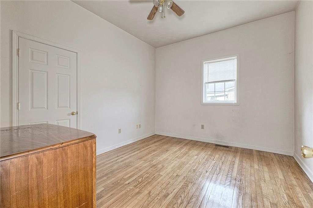 147 South Quarry Street Mount Pleasant, PA 15666 - Photo 13 of 30 wooden floor in an empty room with a window