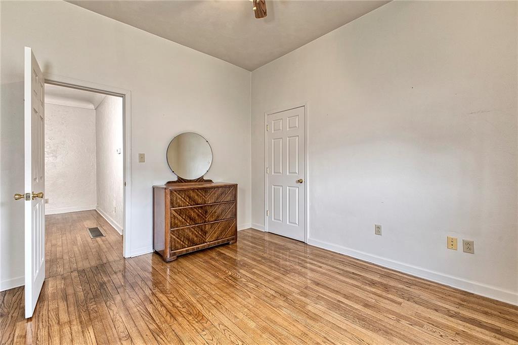 147 South Quarry Street Mount Pleasant, PA 15666 - Photo 14 of 30 a view of a room with wooden floor cabinet and mirror