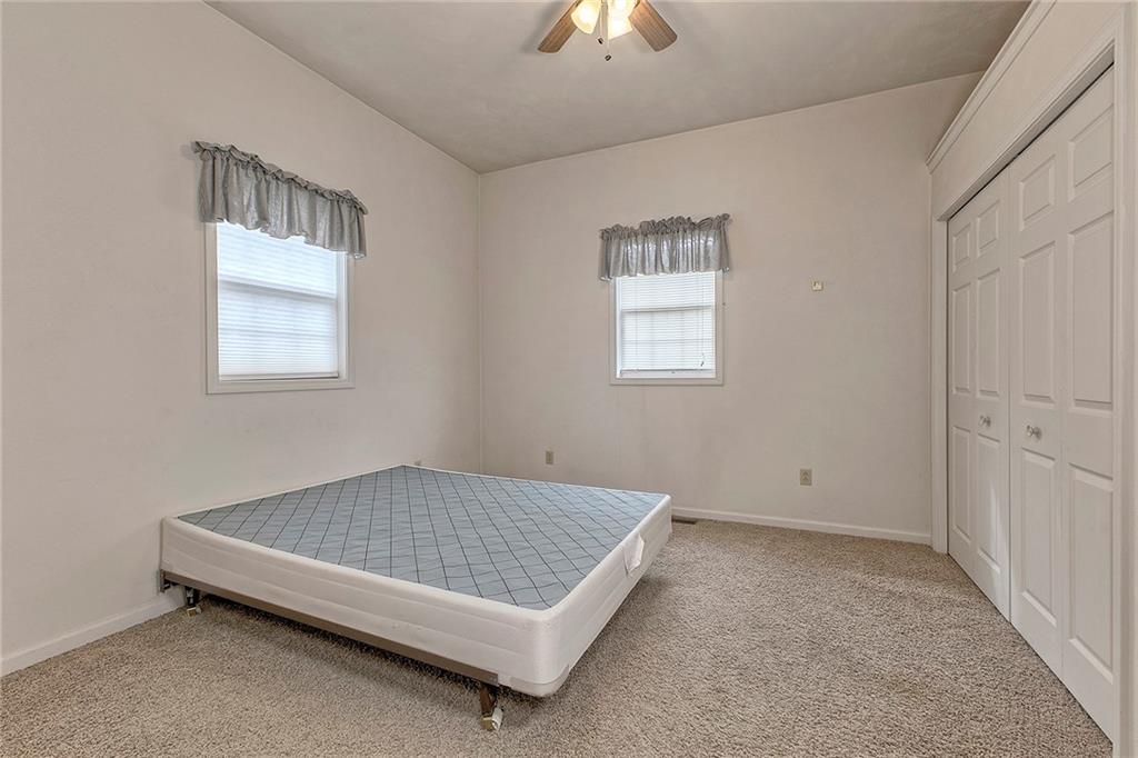 147 South Quarry Street Mount Pleasant, PA 15666 - Photo 21 of 30 a view of a bedroom with a bed and a chandelier fan