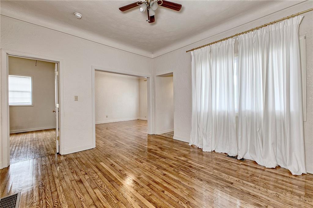 147 South Quarry Street Mount Pleasant, PA 15666 - Photo 9 of 30 a view of a room with wooden floor and a ceiling fan