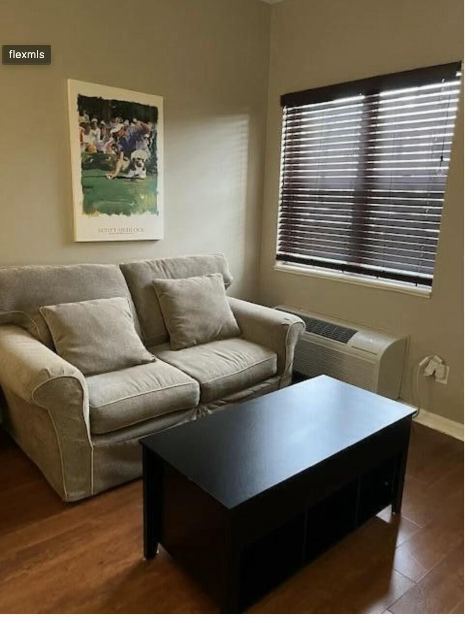 9898 Perfect Drive, Unit 19B Port St. Lucie, FL 34986 - Photo 3 of 10 a living room with furniture and a window