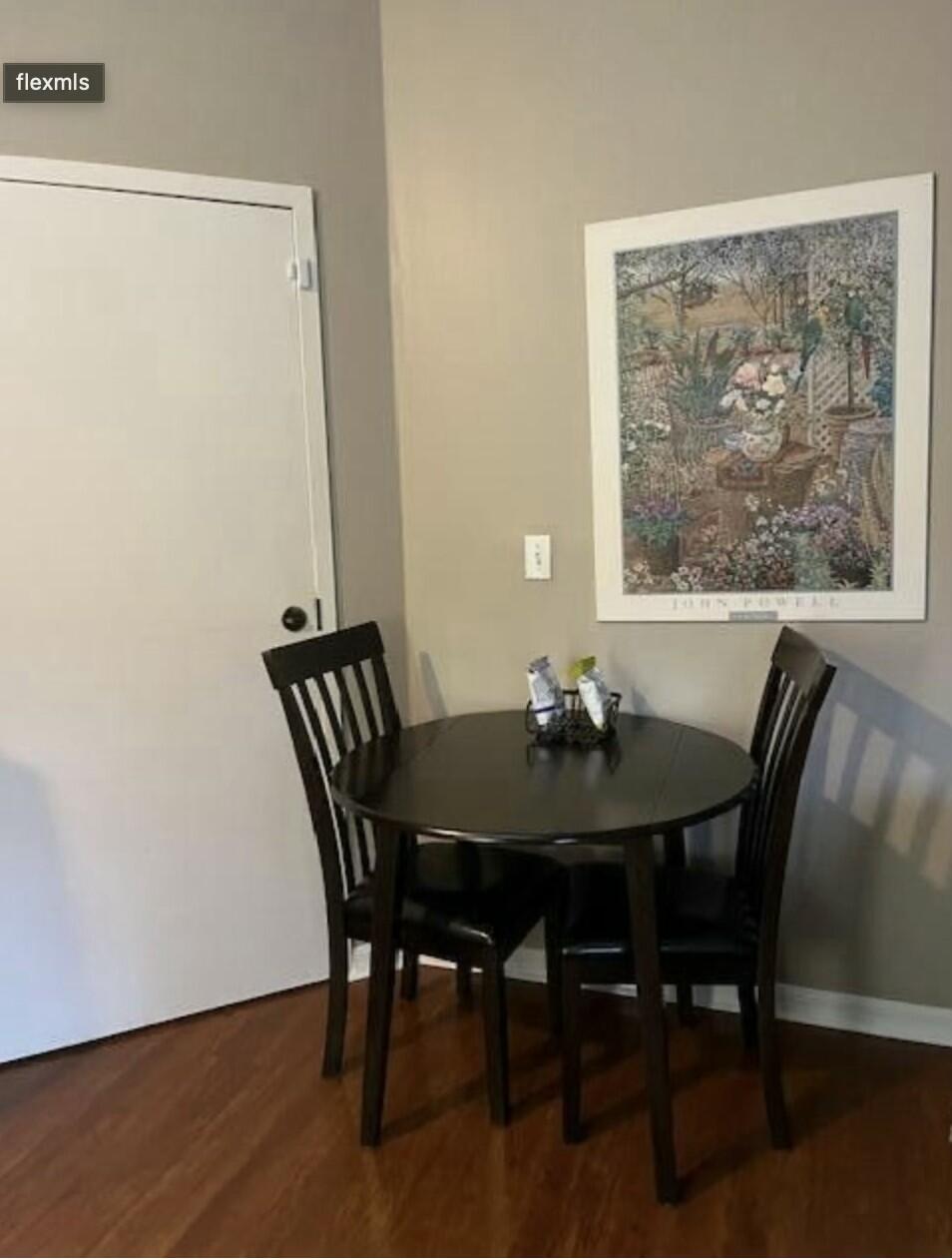 9898 Perfect Drive, Unit 19B Port St. Lucie, FL 34986 - Photo 6 of 10 a view of a dining room with furniture and window