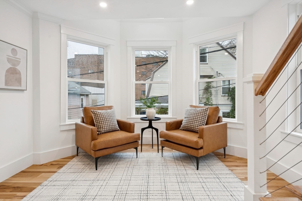 15 Spring Hill Terrace Somerville, MA 02143 - Photo 21 of 38 a living room with furniture and a large window