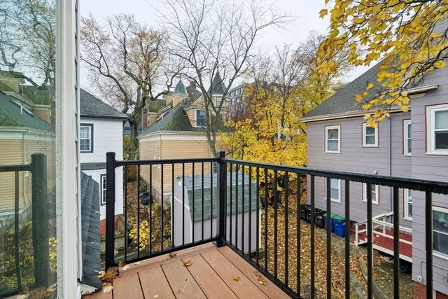 a view of a brick house with a large window