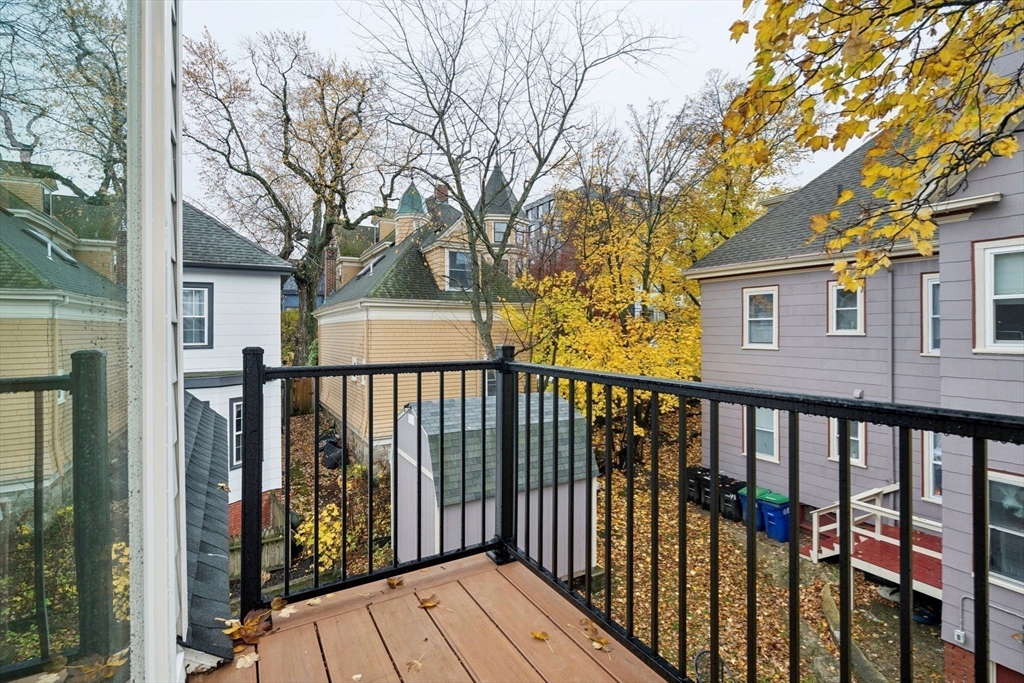 15 Spring Hill Terrace Somerville, MA 02143 - Photo 24 of 38 a view of a brick house with a large window