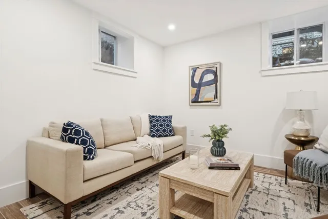 a living room with furniture and a rug