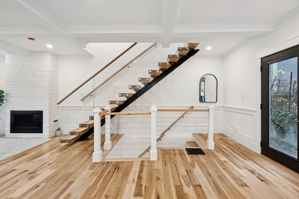 15 Spring Hill Terrace Somerville, MA 02143 - Photo 9 of 38 a view of entryway and hall with wooden floor