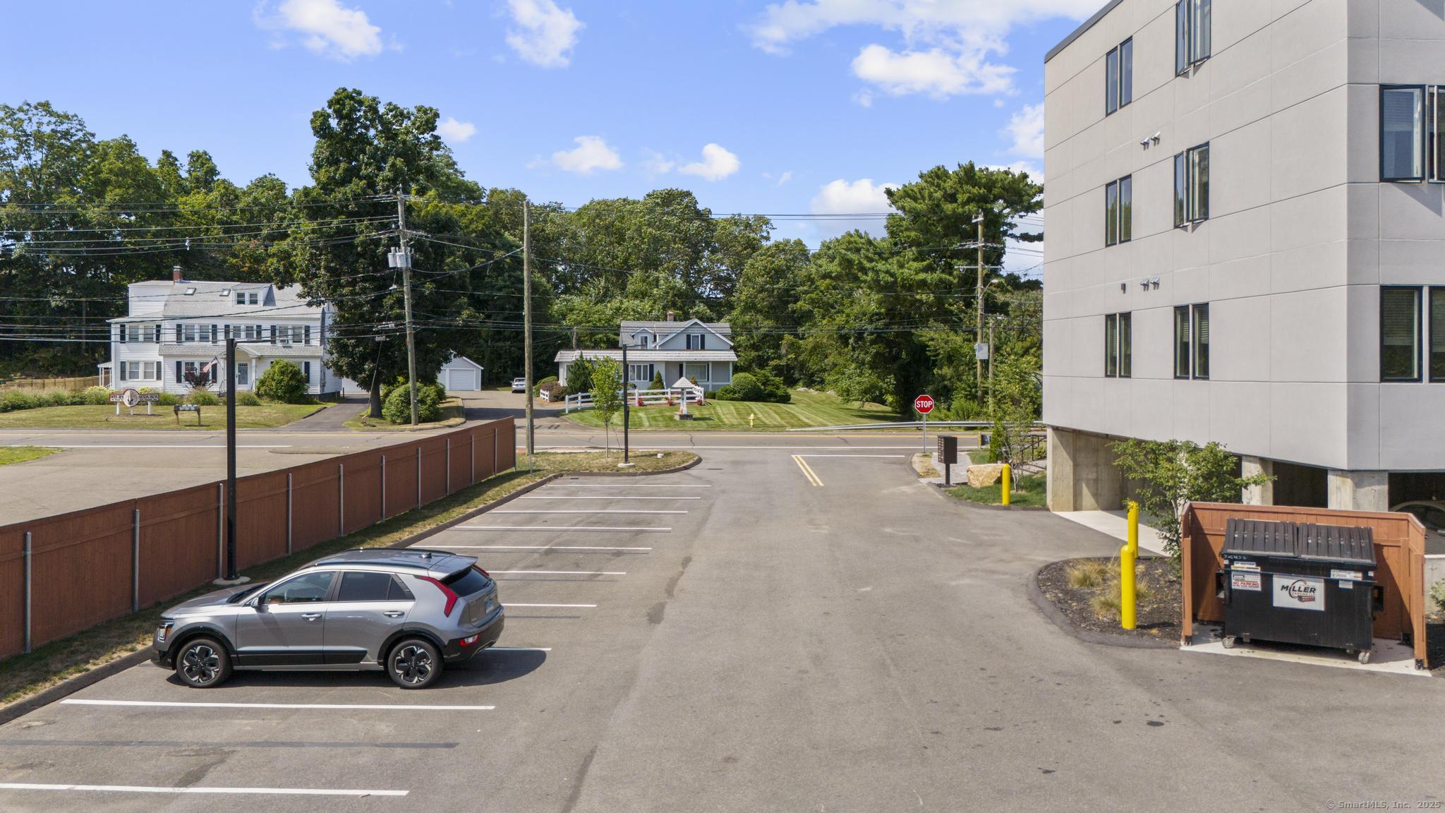 245 East Main Street, Unit 2 Branford, CT 06405 - Photo 13 of 40 a view of a cars park in front of a building