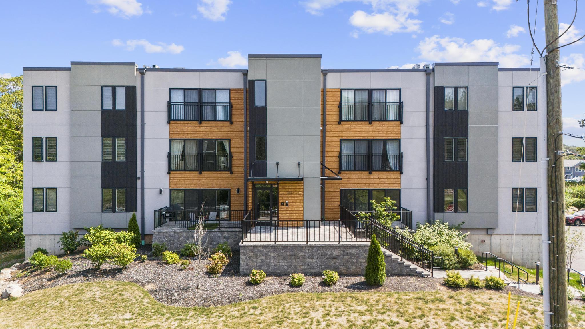 245 East Main Street, Unit 2 Branford, CT 06405 - Photo 2 of 40 a front view of a building and outdoor space