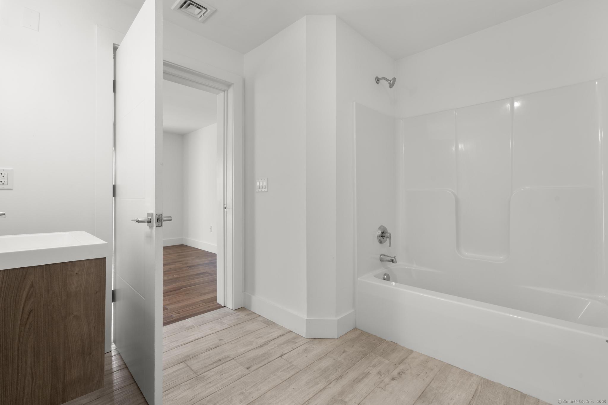 245 East Main Street, Unit 2 Branford, CT 06405 - Photo 30 of 40 a bathroom with a bathtub and shower