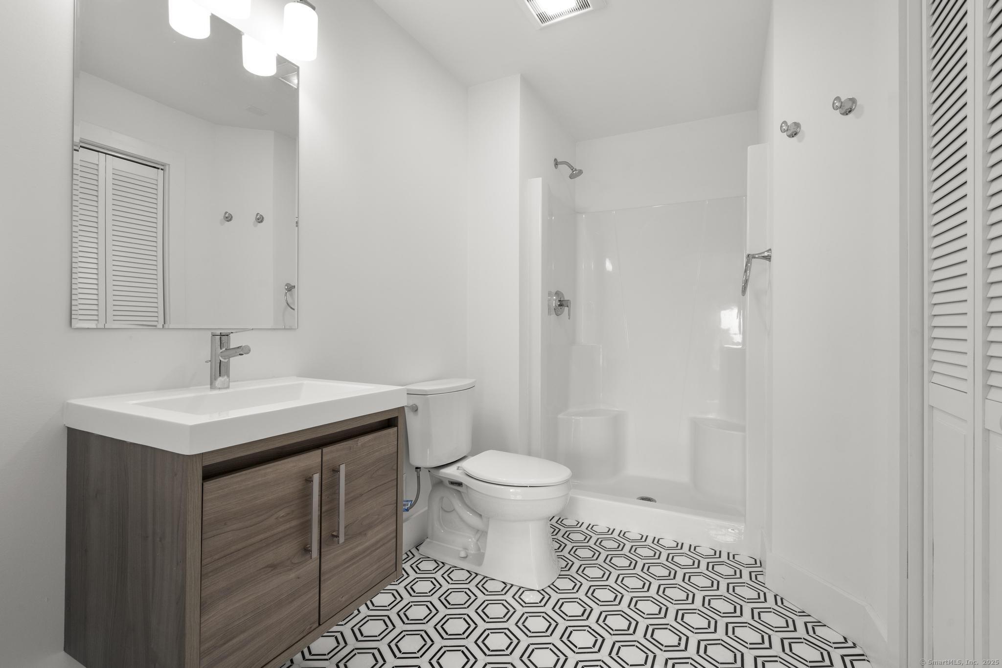 245 East Main Street, Unit 2 Branford, CT 06405 - Photo 40 of 40 a bathroom with a sink toilet and shower