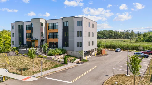 a view of a patio with table and chairs potted plants with wooden fence