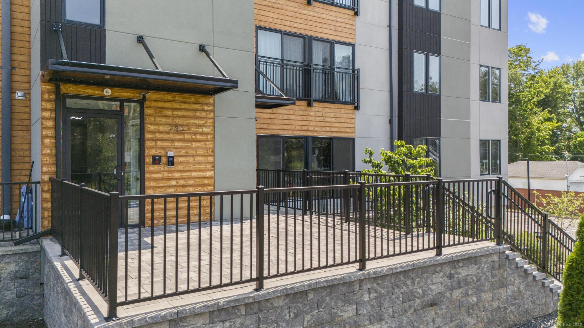 245 East Main Street, Unit 2 Branford, CT 06405 - Photo 7 of 40 a view of a house with a porch