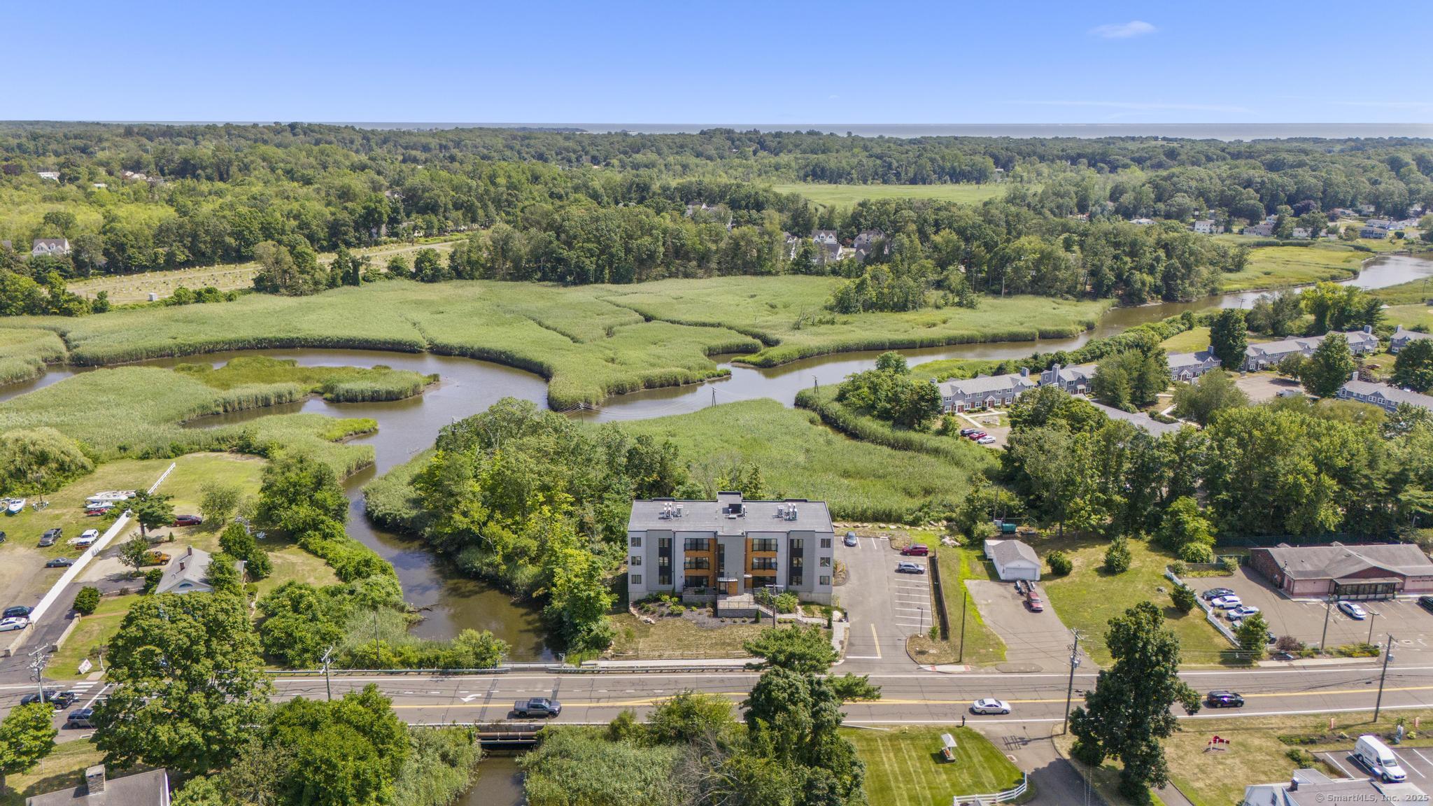 245 East Main Street, Unit 2 Branford, CT 06405 - Photo 8 of 40 an aerial view of a city with lots of residential buildings