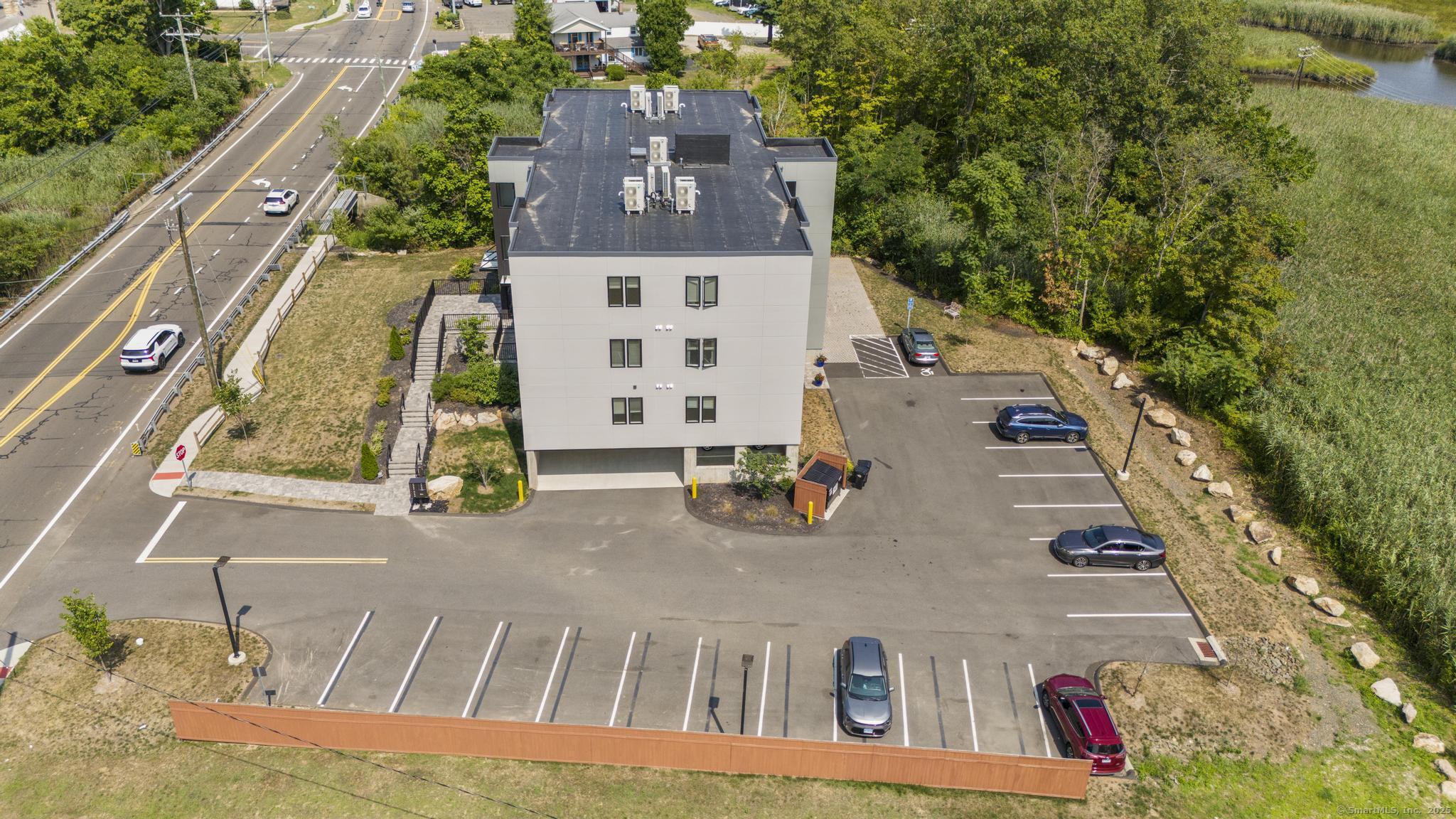 245 East Main Street, Unit 2 Branford, CT 06405 - Photo 9 of 40 an aerial view of a house with swimming pool