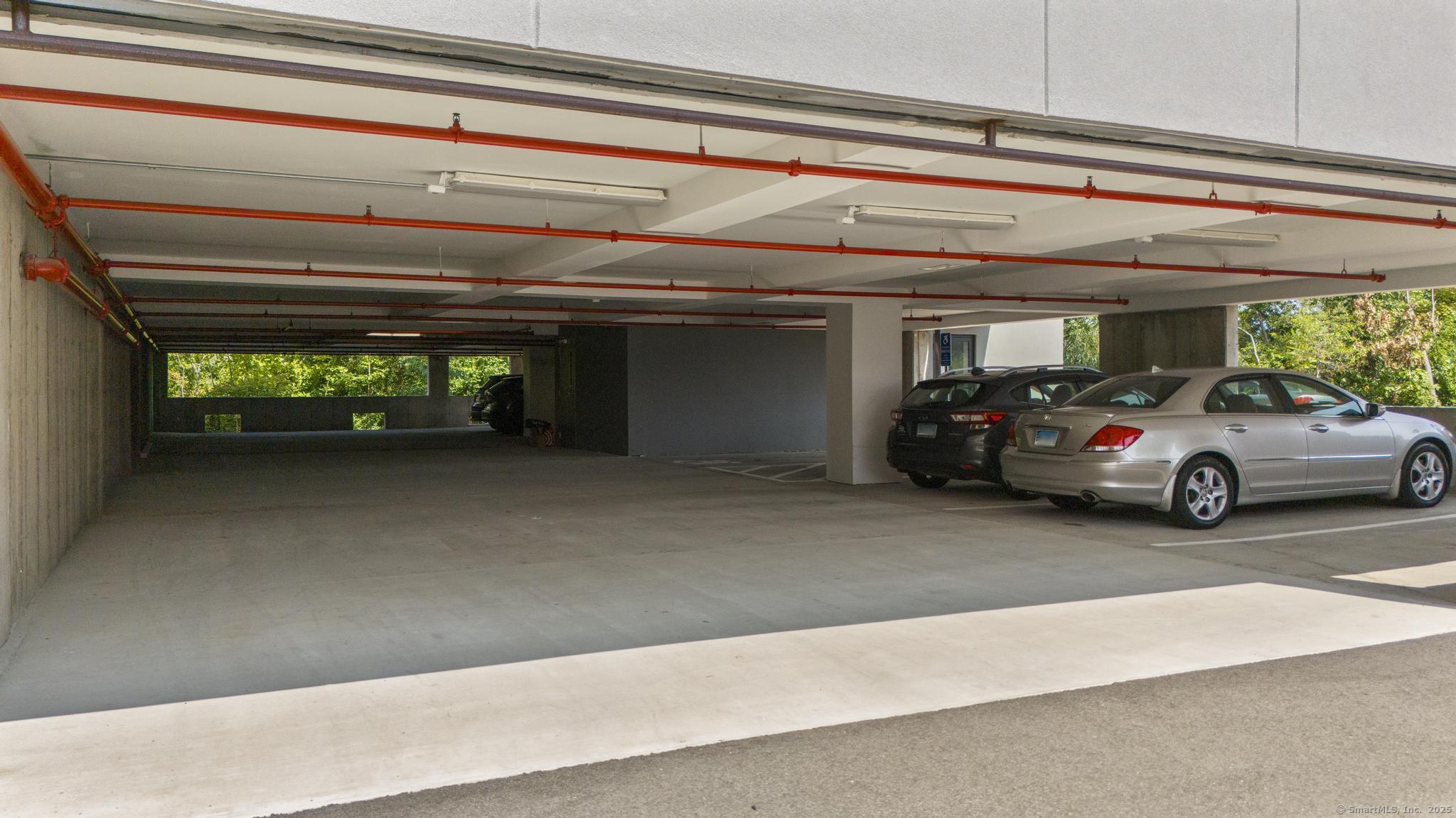 245 East Main Street, Unit 2 Branford, CT 06405 - Photo 10 of 40 a view of garage with a car parked in it
