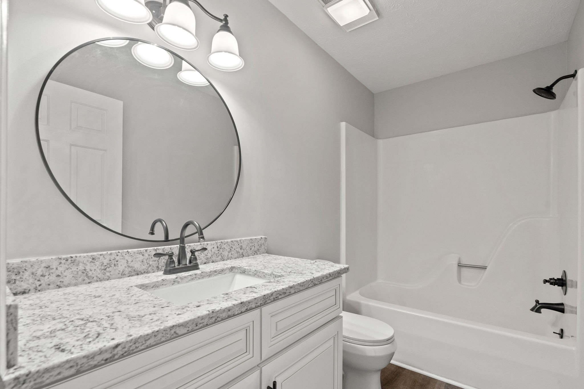 792 Spring Circle Springfield, TN 37172 - Photo 24 of 29 a bathroom with a granite countertop sink a toilet and a mirror
