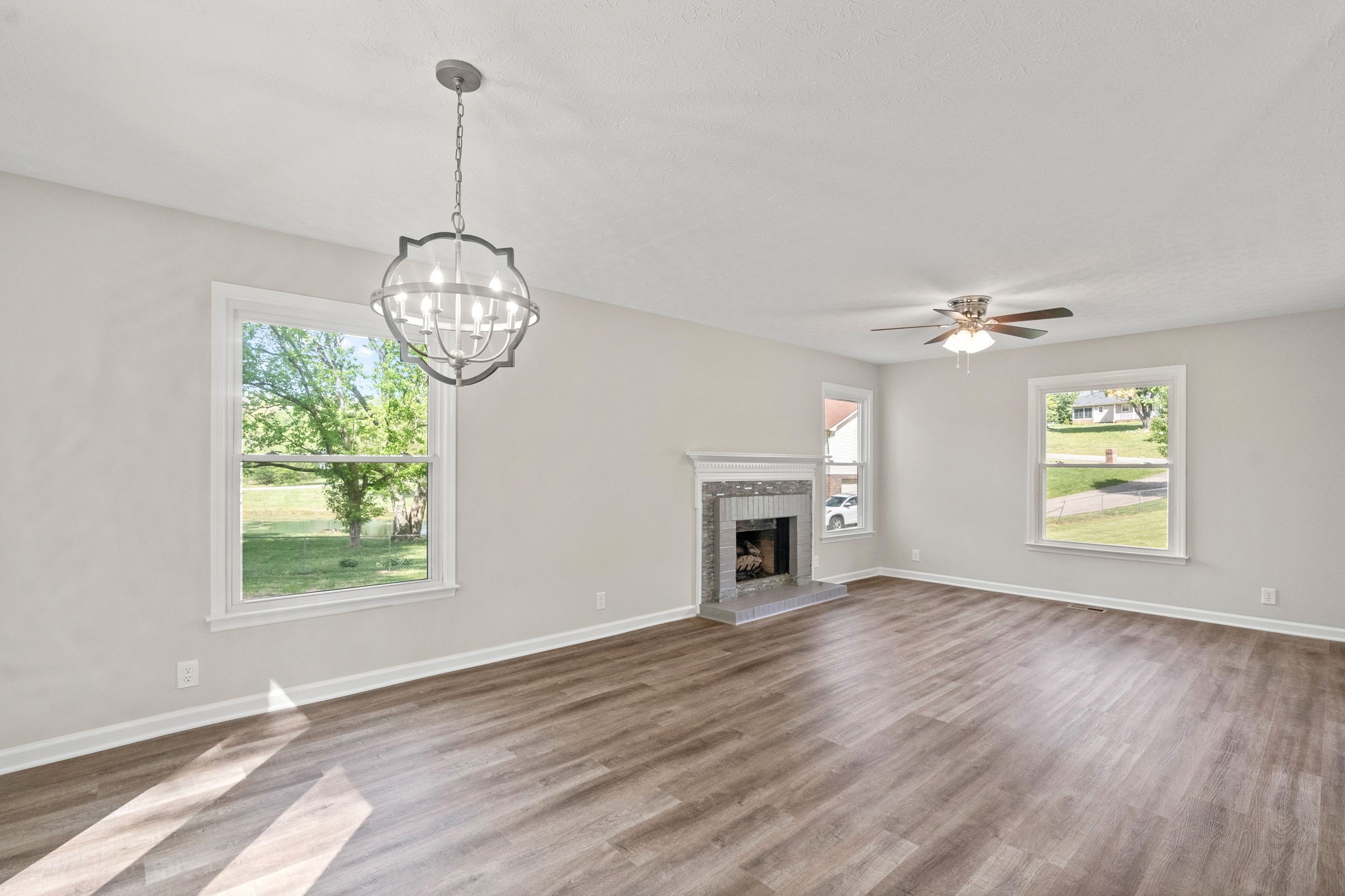 792 Spring Circle Springfield, TN 37172 - Photo 8 of 29 a view of an empty room with window and wooden floor