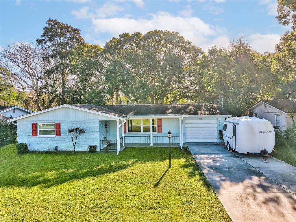 7226 Cedar Point Drive New Port Richey, FL 34653 - Photo 1 of 1 a house view with a garden space