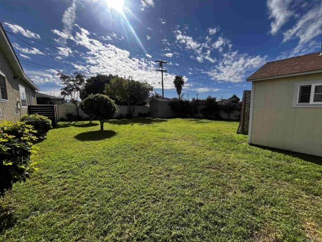 a view of a backyard of the house