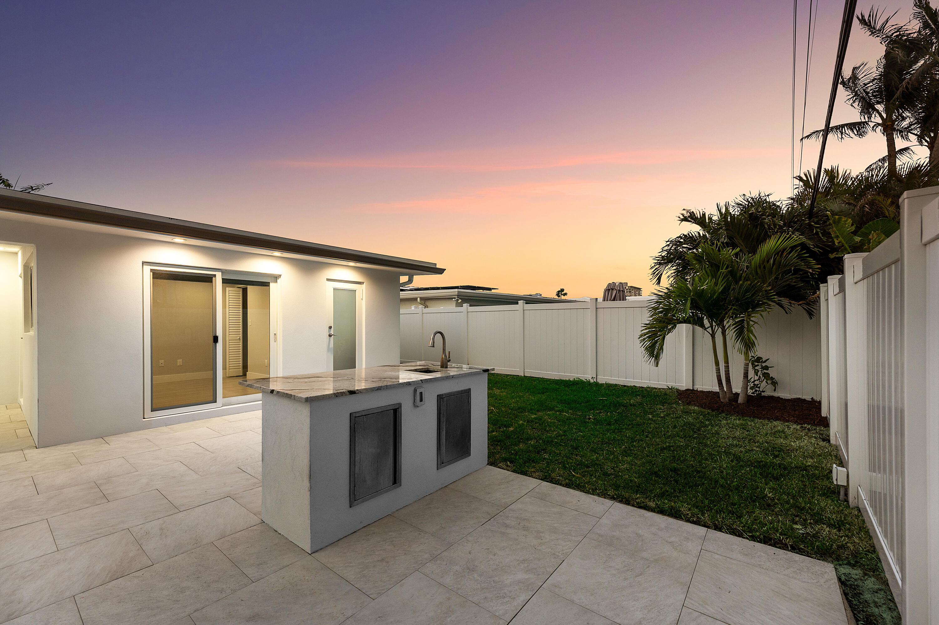 2846 Northeast 35th Court Lighthouse Point, FL 33064 - Photo 26 of 37 a view of a kitchen with a sink and microwave