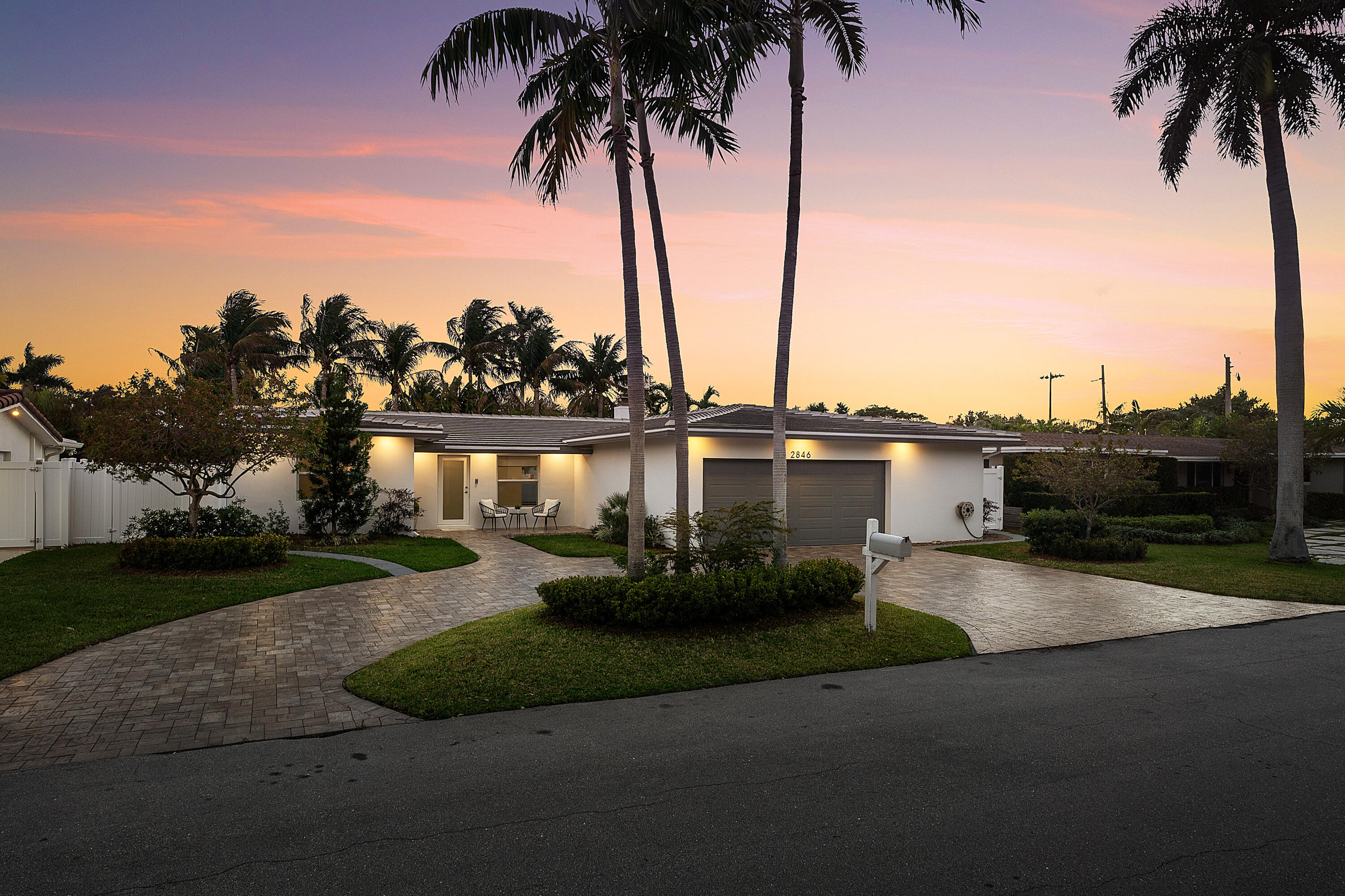 2846 Northeast 35th Court Lighthouse Point, FL 33064 - Photo 27 of 37 a view of a lake with a large trees