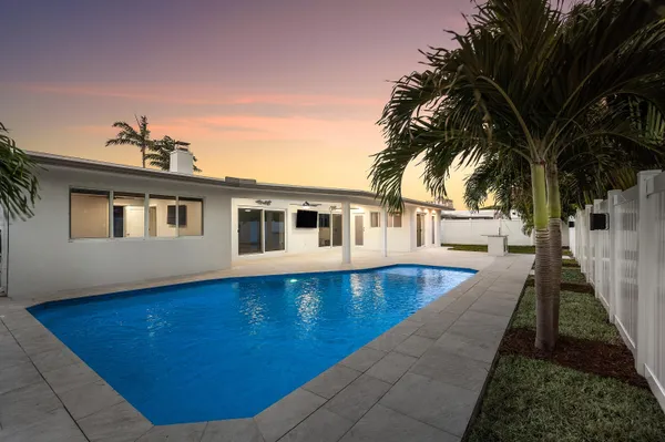 a front view of a house with a swimming pool