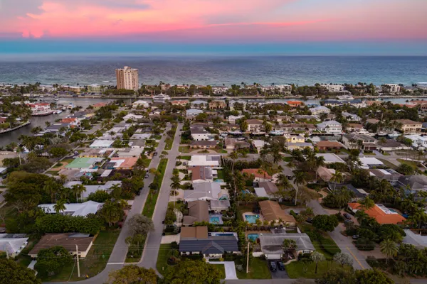 an aerial view of residential houses with outdoor space