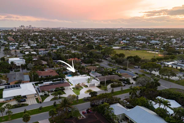 an aerial view of residential houses with outdoor space