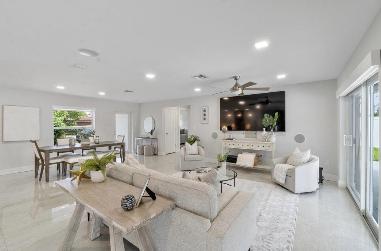 2846 Northeast 35th Court Lighthouse Point, FL 33064 - Photo 5 of 37 a living room with furniture and a flat screen tv