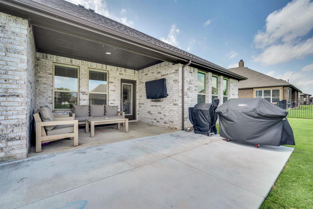 1601 Bear Path Way Gunter, TX 75058 - Photo 35 of 40 a view of a patio with table and chairs with wooden floor and fence