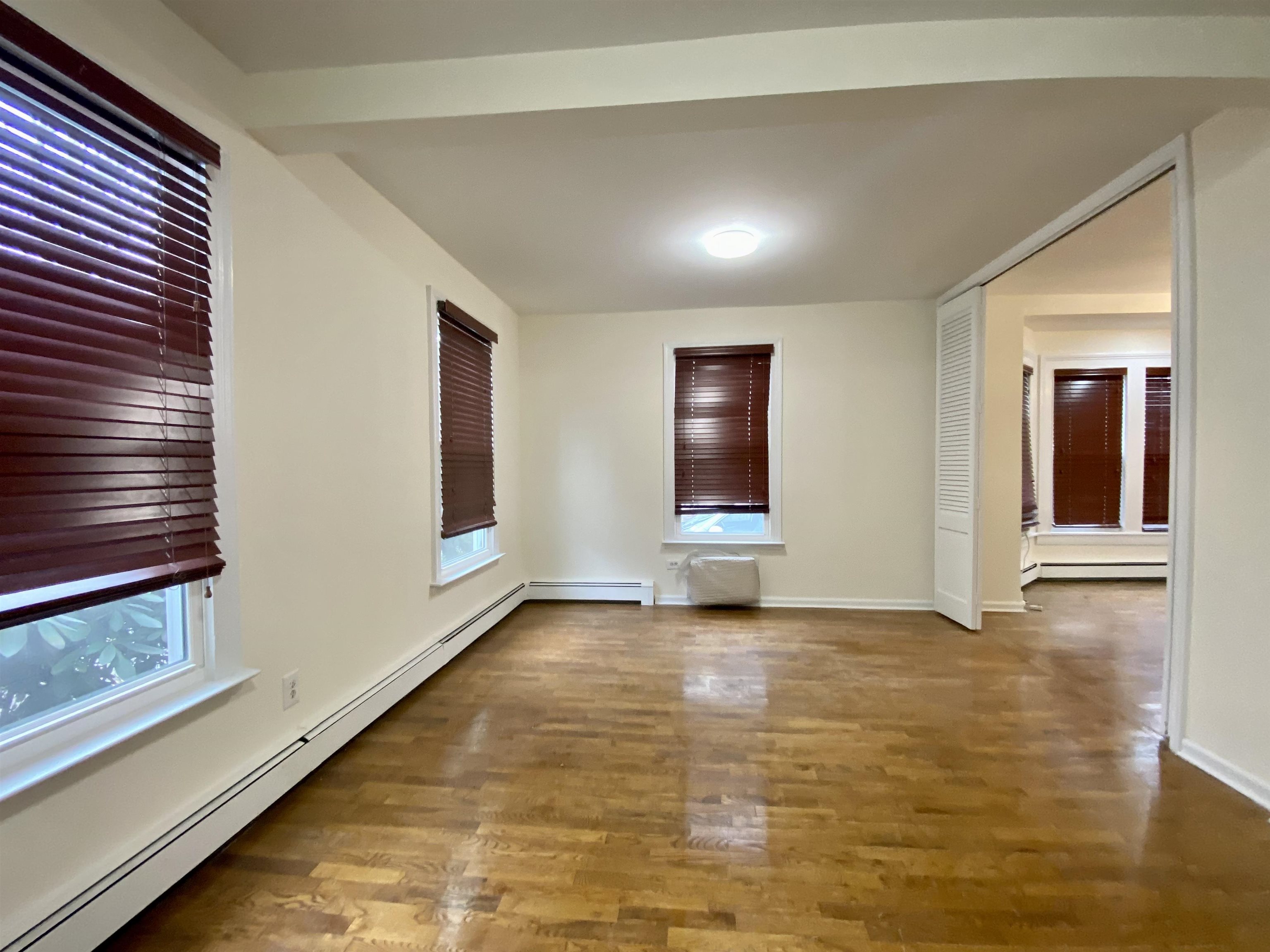 228 Tenafly Road, Unit 1 Tenafly, NJ 07670 - Photo 5 of 10 a view of an empty room and window