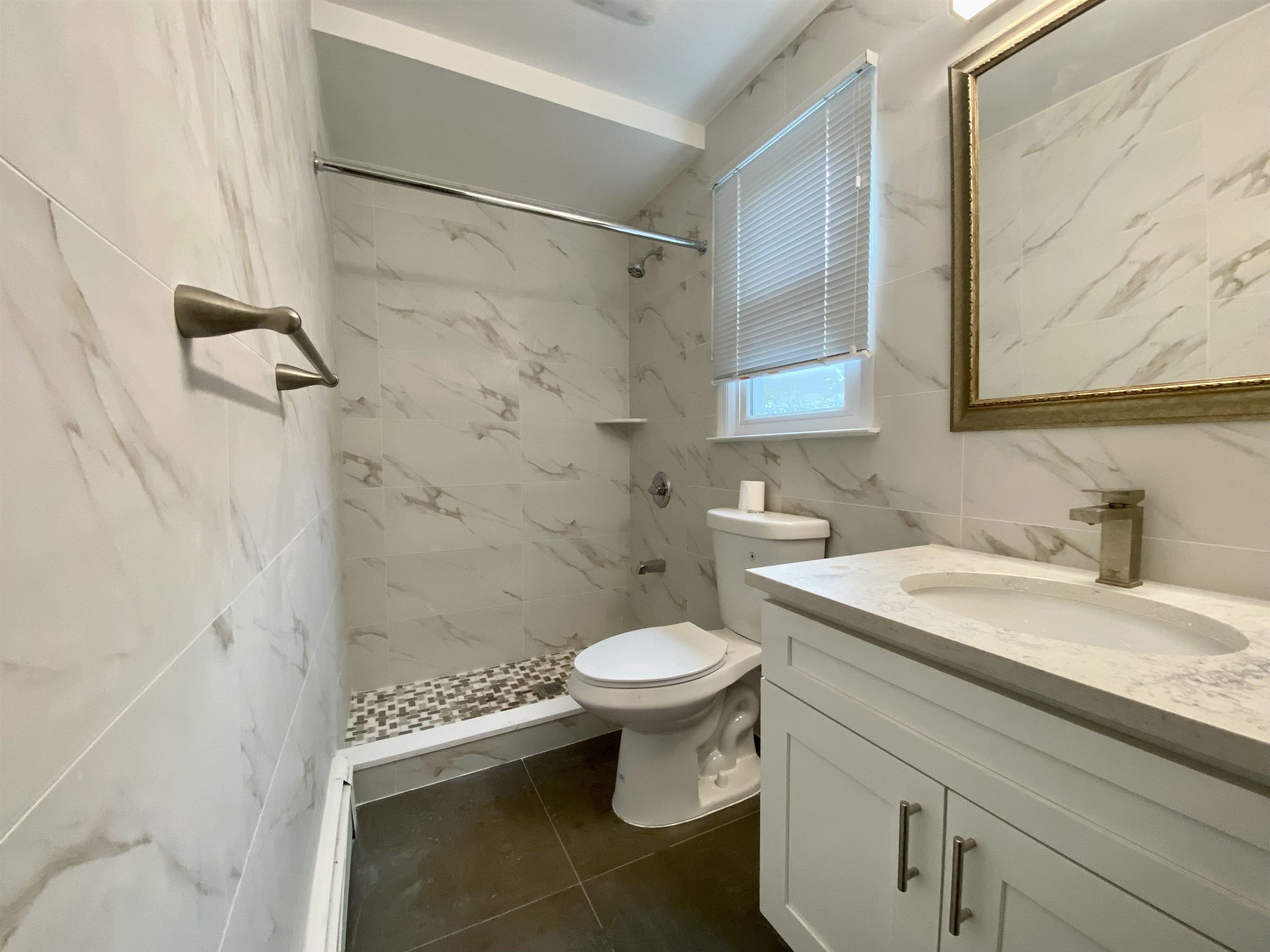 228 Tenafly Road, Unit 1 Tenafly, NJ 07670 - Photo 10 of 10 a bathroom with a sink toilet and shower