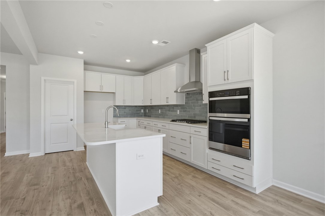 557 Hydrangea Street, Unit LOT 46 Seneca, SC 29678 - Photo 10 of 37 Culinary delights await in this bright kitchen with a large island and ample cabinetry.