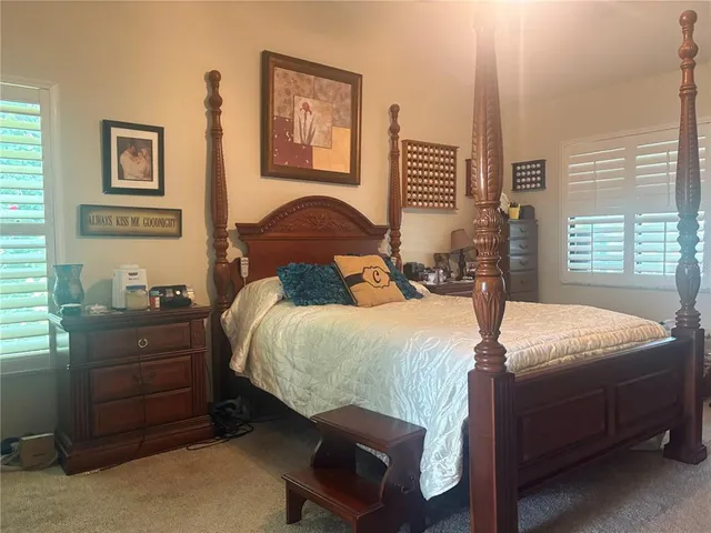 a bedroom with a bed and a closet