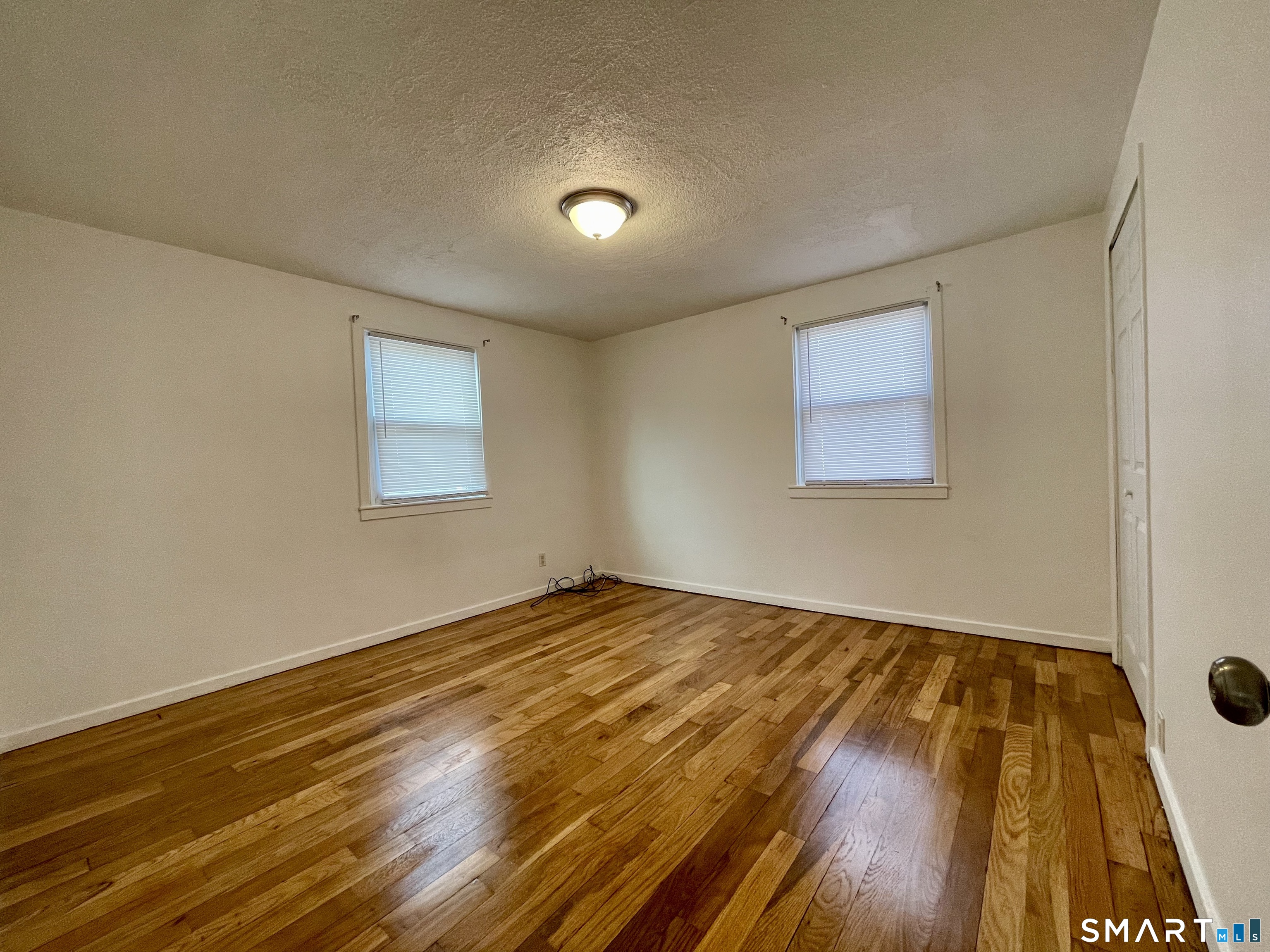 35 Baltic Street Hartford, CT 06112 - Photo 11 of 18 a view of an empty room and wooden floor