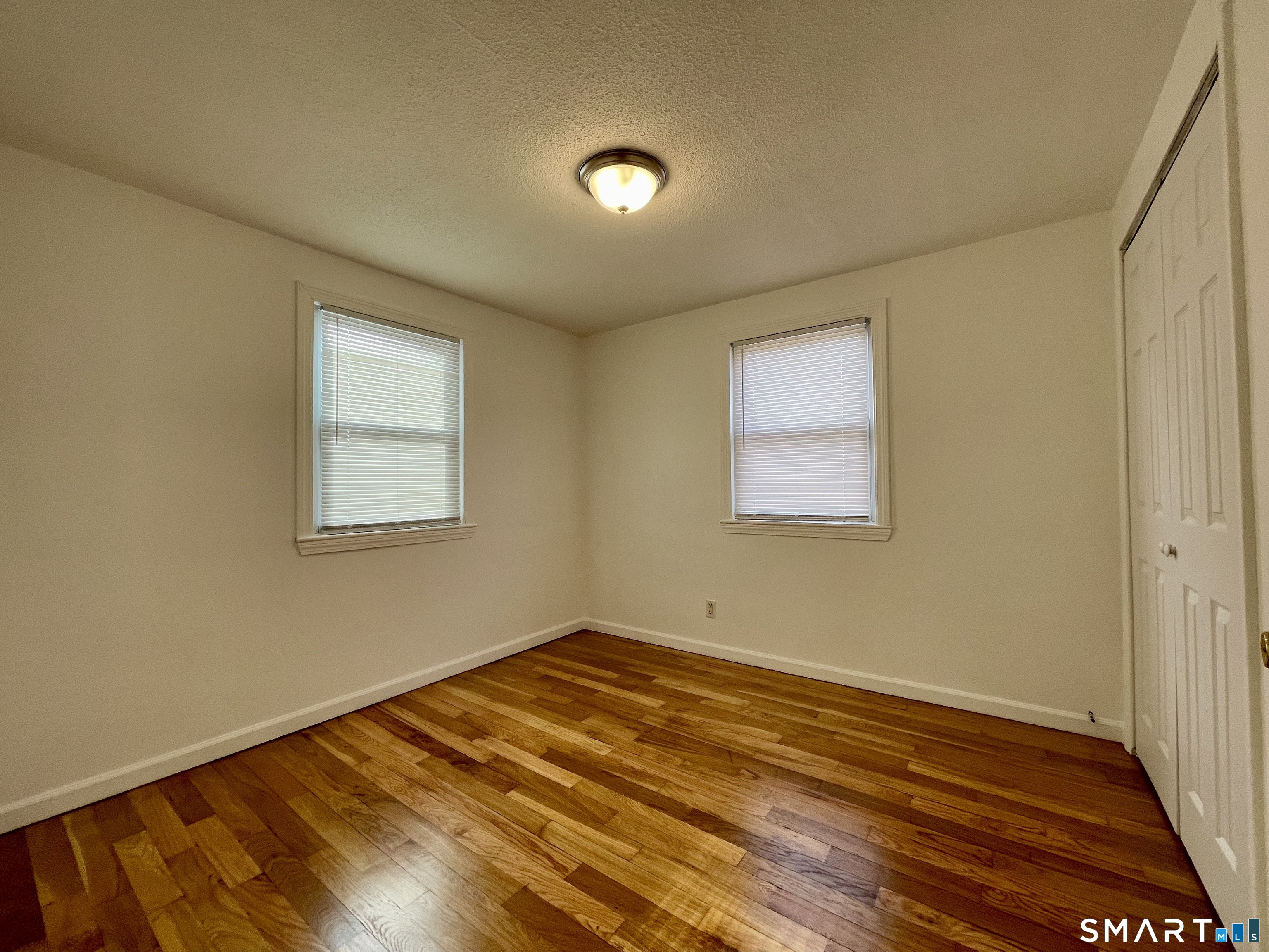 35 Baltic Street Hartford, CT 06112 - Photo 13 of 18 a view of a room with wooden floor and fan