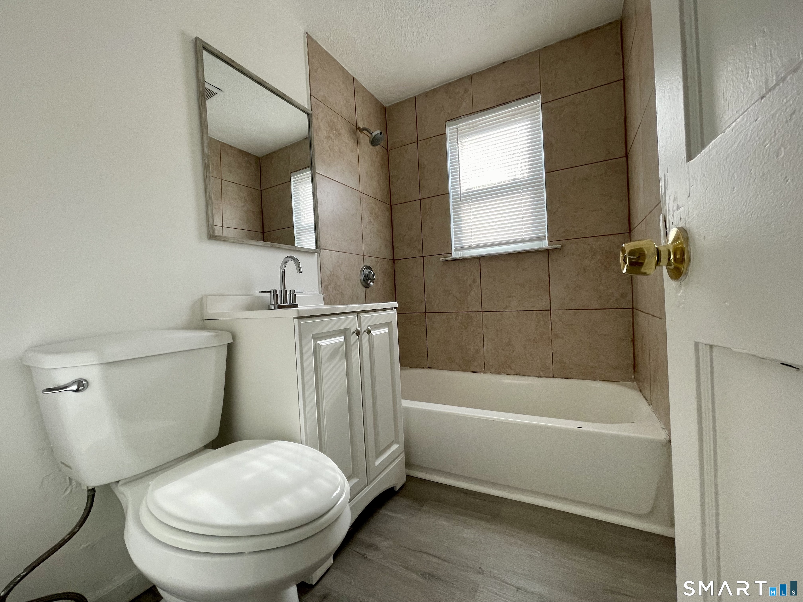 35 Baltic Street Hartford, CT 06112 - Photo 9 of 18 a bathroom with a toilet a sink and bathtub