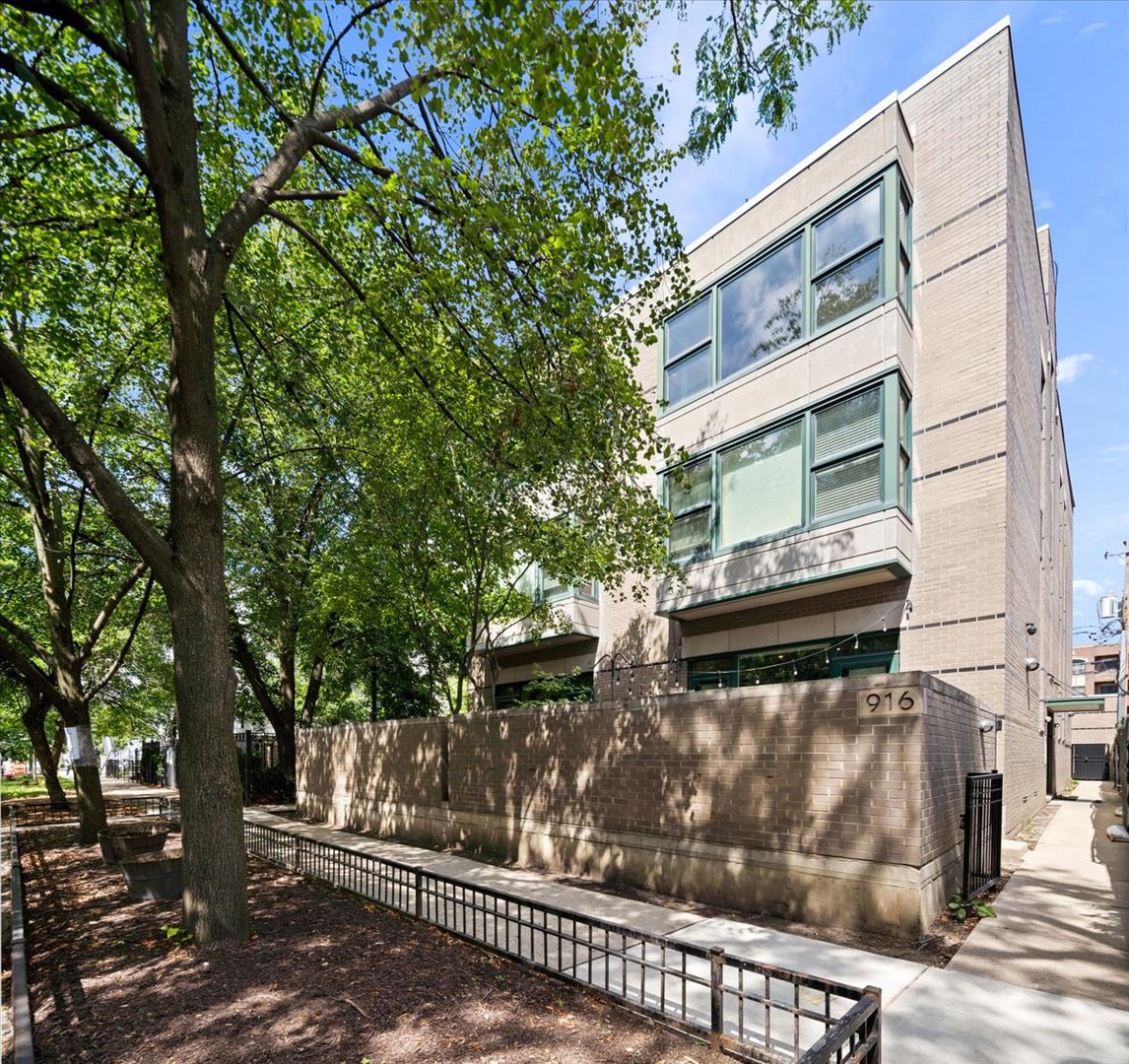 916 West Fletcher Street, Unit C Chicago, IL 60657 - Photo 1 of 16 a view of a street with a tree