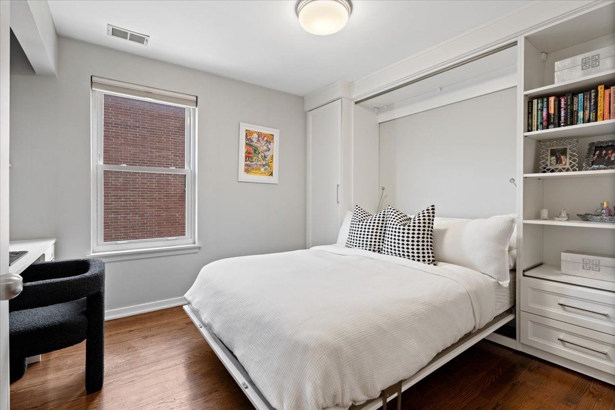 916 West Fletcher Street, Unit C Chicago, IL 60657 - Photo 13 of 16 a bedroom with a bed and a window