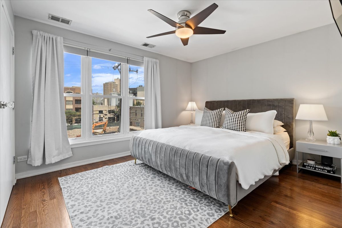 916 West Fletcher Street, Unit C Chicago, IL 60657 - Photo 7 of 16 a bedroom with a large bed and a window