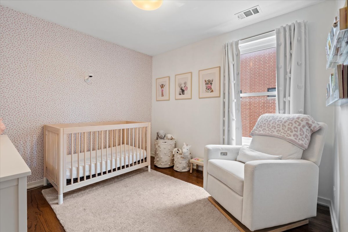 916 West Fletcher Street, Unit C Chicago, IL 60657 - Photo 9 of 16 a bedroom with furniture and a window