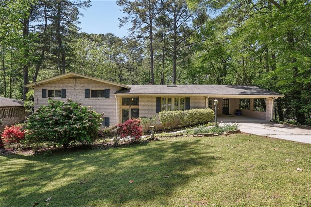 1496 Country Squire Drive Decatur, GA 30033 - Photo 1 of 1 a front view of house with yard and trees in the background