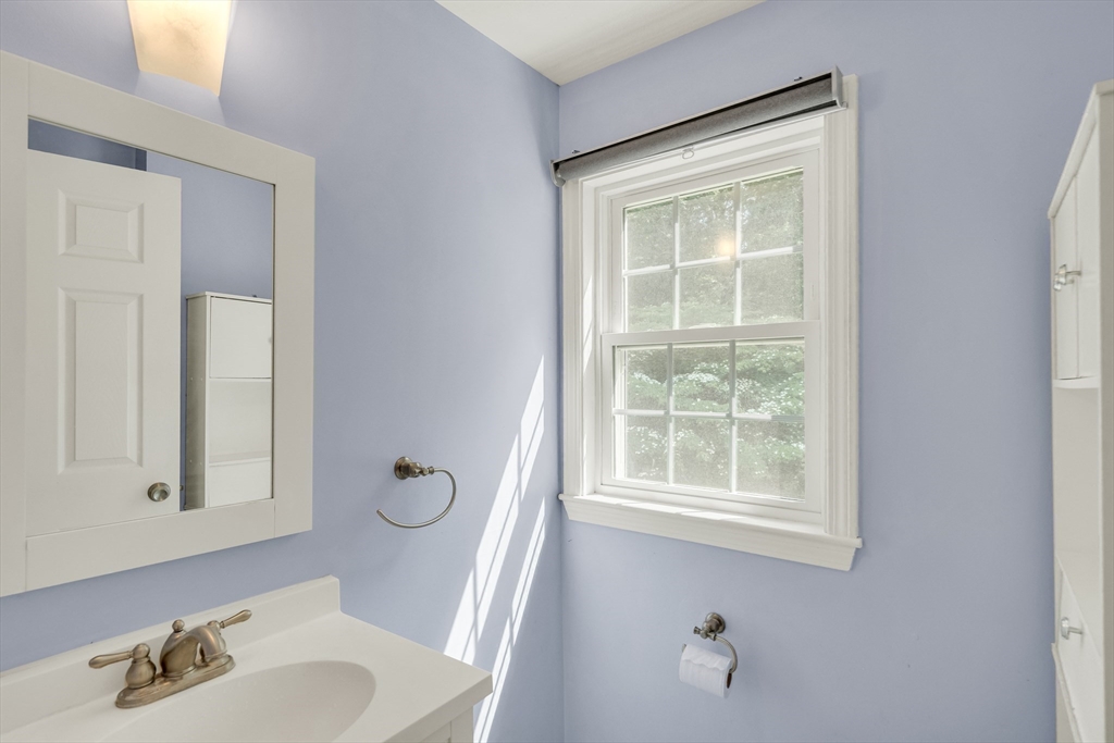 58 MacIntosh Lane, Unit 58 Boxborough, MA 01719 - Photo 12 of 23 a bathroom with a granite countertop sink and a window