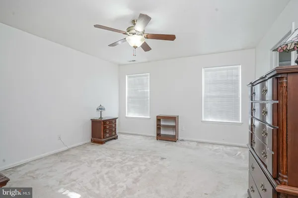 a view of livingroom with furniture and chandelier fan