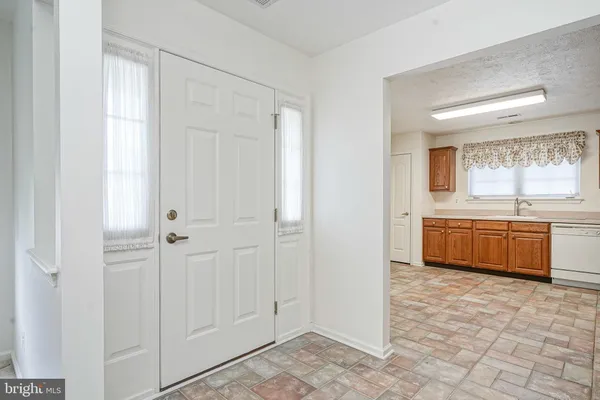 a large bathroom with a double vanity sink a mirror and a bathtub