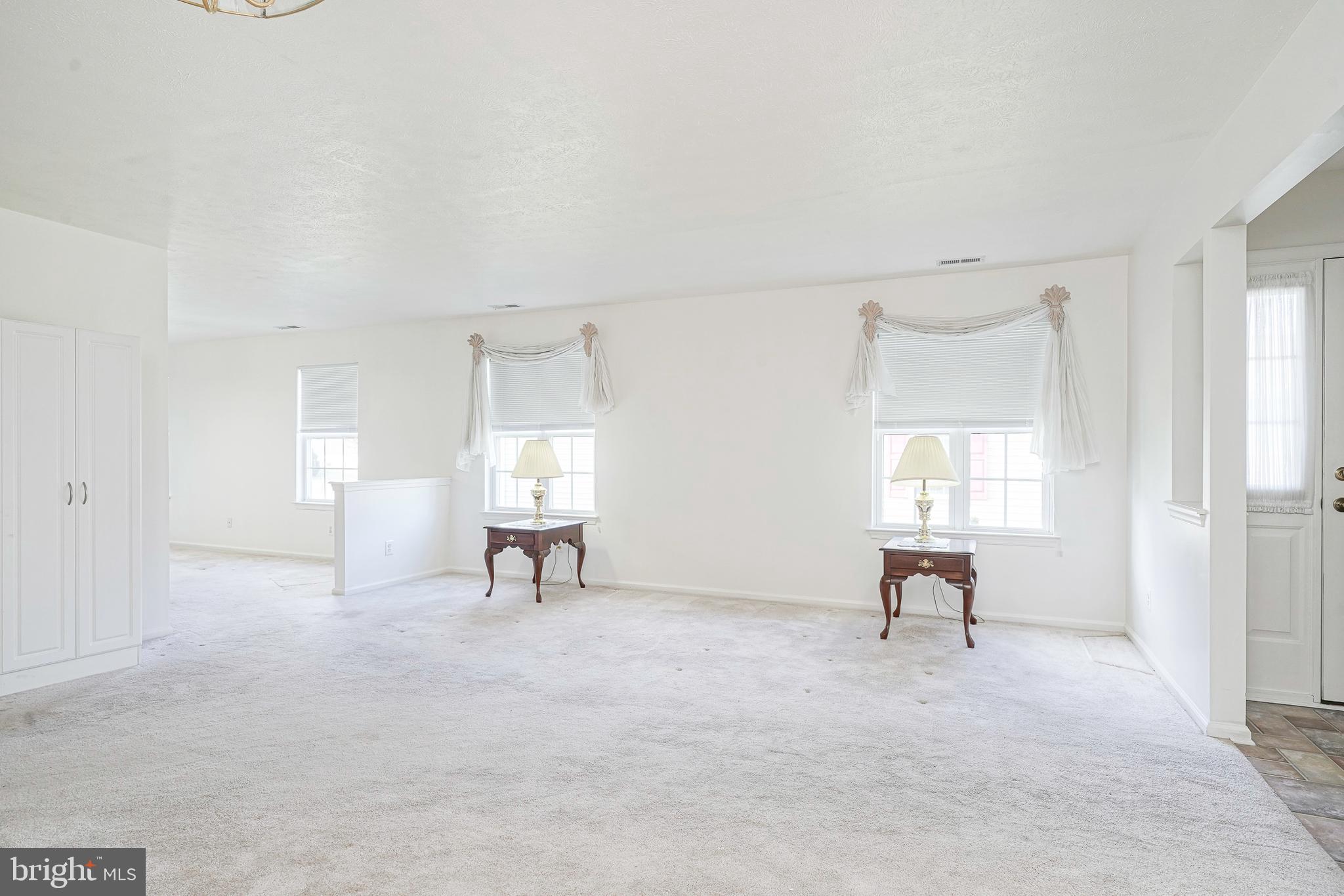 16 Magnolia Lane Sewell, NJ 08080 - Photo 6 of 21 a view of a livingroom with a chair and window